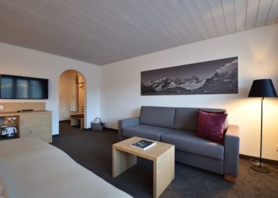 Familienzimmer Deluxe Wohnzimmer | Hotel Laaxerhof